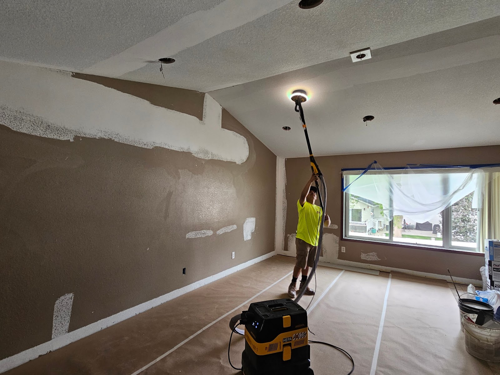 Drywall ceiling sanding in progress